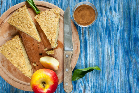 Homemade apple pie on wooden plate. Vintage background