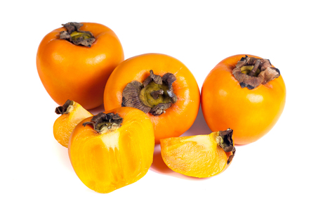 Persimmons fruits isolated on white backgroundの写真素材
