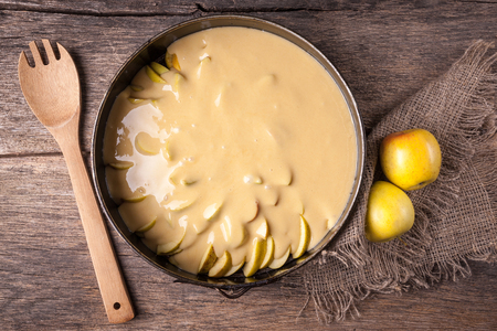 Ingredients for apple pie in tray on wooden table. homemade style.の写真素材