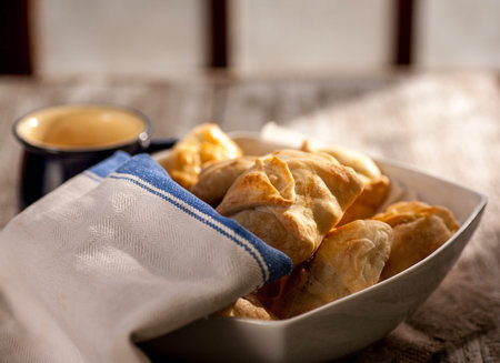 Pies in peasant style on a wooden rustic table. Morning light. Selective focus
