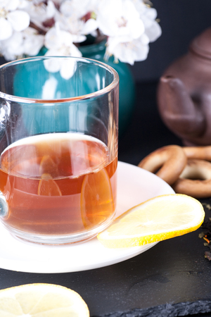 Bergamot green tea and blossom apricot on tableの写真素材