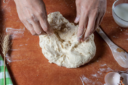 Baker prepared dough for baking delicious on  kitchen table