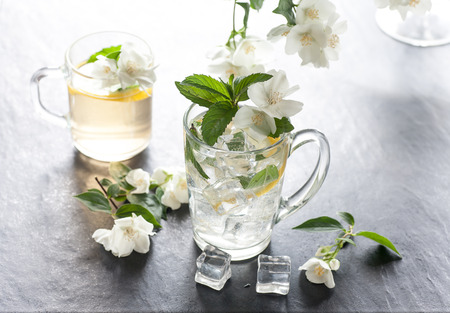 cup of ice juice with jasmine on stone backgroundの写真素材