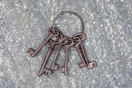 Old keys on stone background