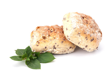 Homemade bread with leaves isolated on white backgroundの写真素材
