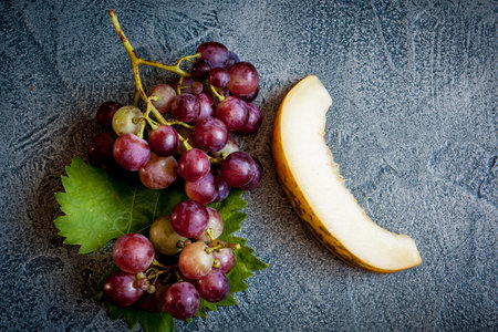 Grape with melon on vintage backgroundの写真素材