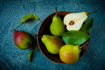 Fresh pears in bowl on stone vintage tableの写真素材