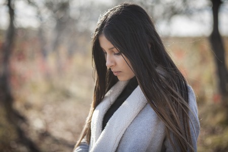 Portrait of a beautiful girl in the  autumn parkの写真素材