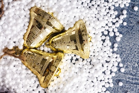 Bells on artificial snow, happy new year card.の写真素材