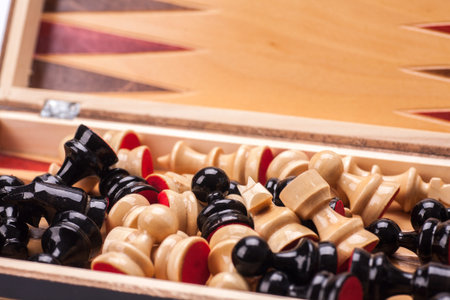 Close up Wooden Chess Pieces on Board. Isolated on white background