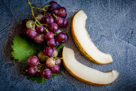 Grape with melon on vintage backgroundの写真素材