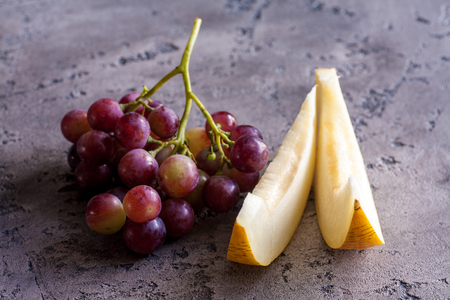 Grape with melon on vintage backgroundの写真素材