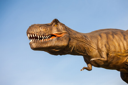 Park of dinosaurs. A dinosaur on the background of nature. Toy dinosaurs in amusement park.の写真素材