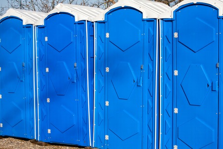 A large number of street toilets in the city park.の写真素材