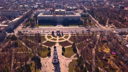 Aerial view of drone flying over city with downtown in background during the day in Kishinev, Moldova republic of.の写真素材