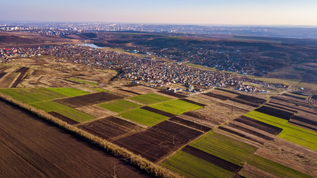 Aerial drone flight over a suburban community on a sunny summer day.の写真素材
