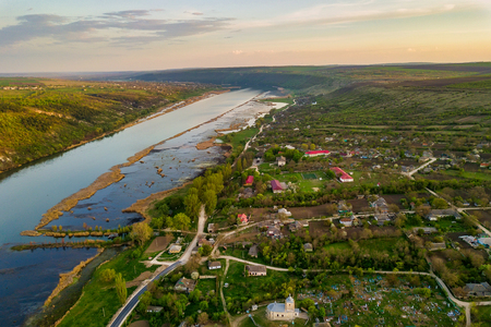 Arial view over the river and small village. Dniester river of Moldova republic.の写真素材