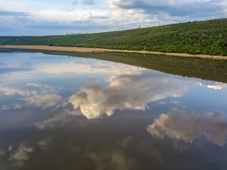 Flight over the river and forest at spring time. Dniester river of Moldova republic.の写真素材
