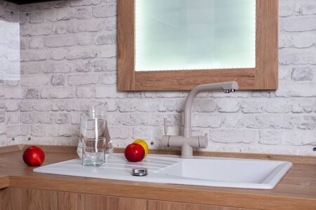 Healthy lifestyle, apples and oranges in white interior kitchenの写真素材