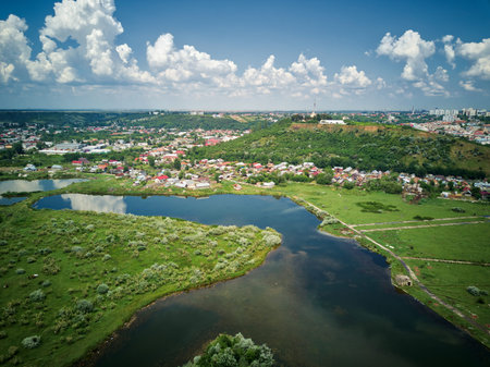 Aerial view of blue river whit reflections on a sunny summer day. Drone photography.