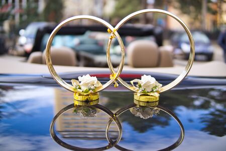 Decorative wedding rings on the carの写真素材