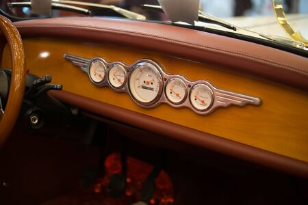 Interior view of classic vintage car. Beautiful retro car, interior elements, chrome and wood, the concept of expensive collector cars, premium classの写真素材