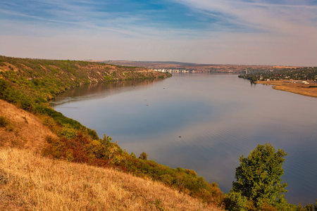Beautiful autumn landscape with a river in the early morning, The Dniester river in Moldova near the...