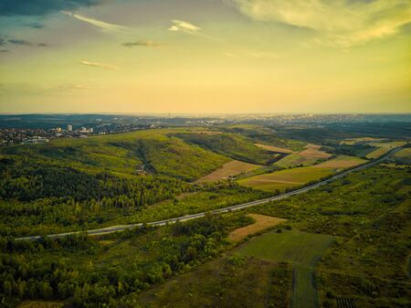 Aerial drone view of grain fields, wheat during golden sunset. Agricultural pattern. Moldova republic of.の写真素材