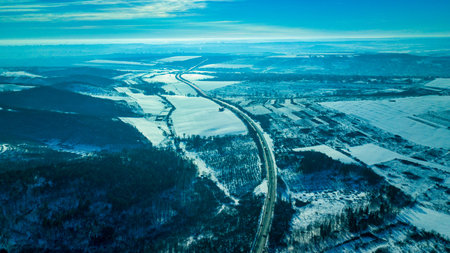 Aerial or top view from a drone on a highway in winter weather