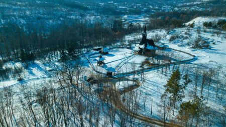 top view of a old wooden church in Kishinev, republic of Moldova. Winter landscape whit wooden churchの写真素材