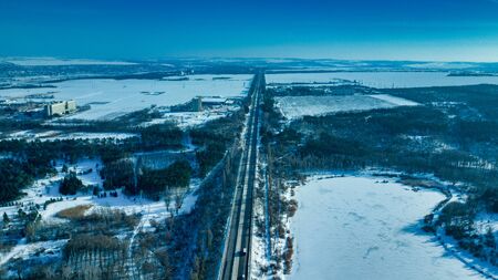 Aerial or top view from a drone on a highway in winter weatherの写真素材
