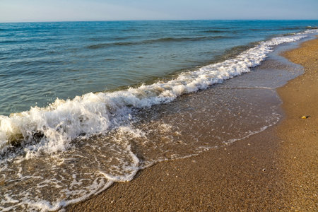 Soft wave of the sea on the sandy beachの写真素材