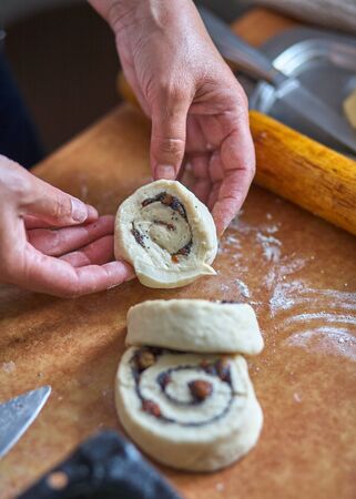Knead the dough for cinnamon rollsの写真素材