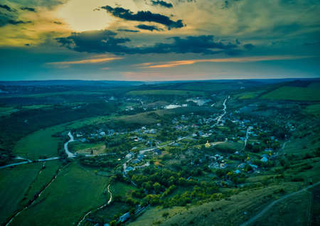 Beautiful sunset above the small rural villageの写真素材