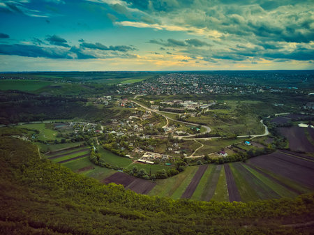 Little moldavian village Goeni in green lands, aerial view, summer time, Moldova republic of.