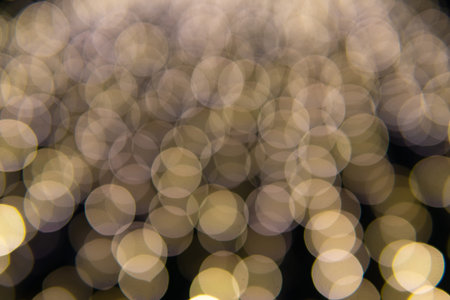 Background of New Year's garlands like stars. Christmas atmosphere with garlands in defocus.