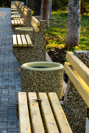 Benches in autumn park. Free benches in rainy autumn parkの写真素材