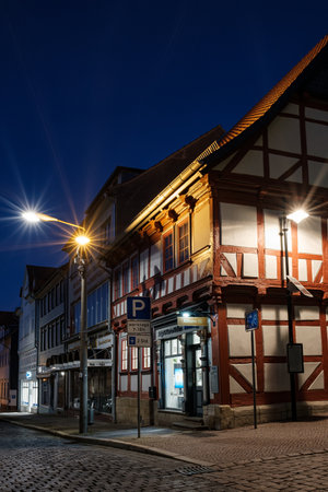 22 October 2021. Bleicherode, Germany: Street alley in the small town of Schwabisch Hall, with houses and buildings with typical German architecture and street lanterns, at night.のeditorial素材