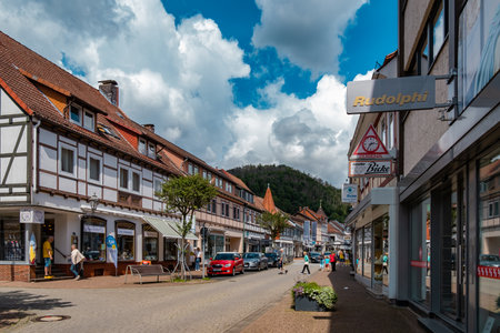 SondeBad Lauterberg, Germany - August 04, 2023: the street Hauptstra e with shops and cafes on a sunny summer day with cloudy sky - a hill of the Harz mountains can be seen in backgroundrhausen old german gothic town near Erfurt. Tipical german architectuのeditorial素材