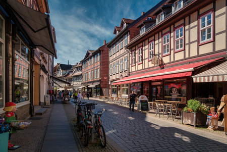 Wernigerode, Germany - 08/17/2023: The beautiful fairytale Wernigerode and its picturesque colorful half-timbered houses. Medieval street with half-timbered houses.のeditorial素材