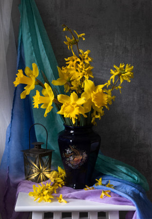 A stunning arrangement of vibrant yellow flowers in a vintage pitcher, showing natures captivating beauty. Yellow daffodilsの写真素材