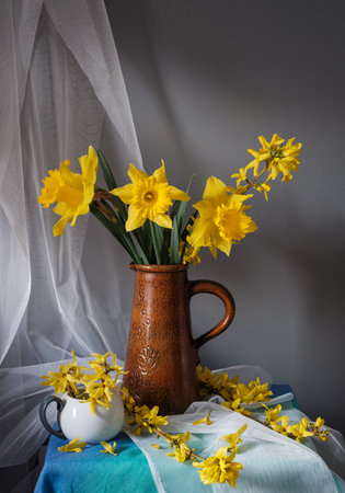 A stunning arrangement of vibrant yellow flowers in a vintage pitcher, showing natures captivating beauty. Yellow daffodilsの写真素材