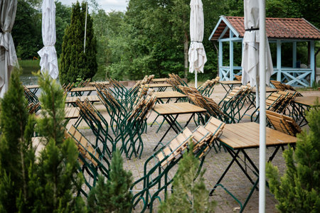 Outdoor Caf Setting with Tables and Umbrellasの写真素材