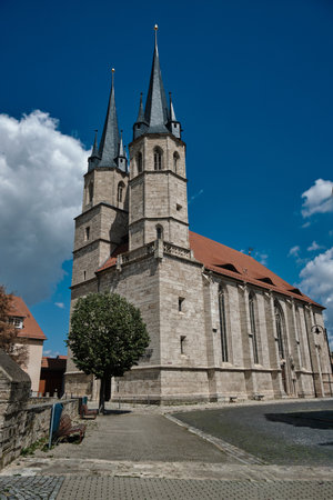 A breathtakingly stunning view showcasing a Gothic church tower set against a bright blue sky above. Germany.の写真素材