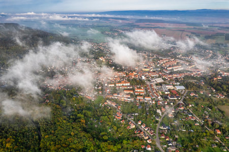 Scenic rural panorama, wide view of peaceful village embracing natural beautyの写真素材