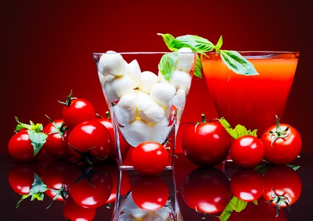 Tomatoes, tomato juice, and mozzarella cheeseの写真素材
