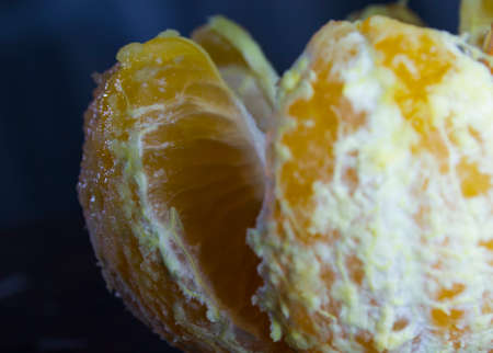 Opened tangerine close-up. Fresh fruitの写真素材