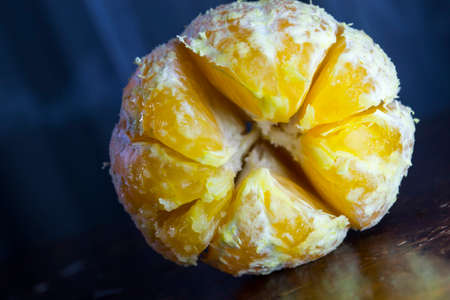 Opened tangerine close-up. Fresh fruitの写真素材