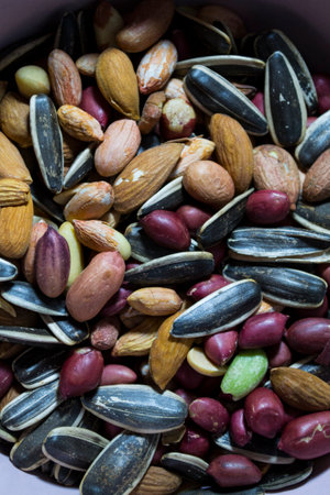 A mixture of different types of nuts and seeds. Ground nuts, almonds, seeds.の写真素材