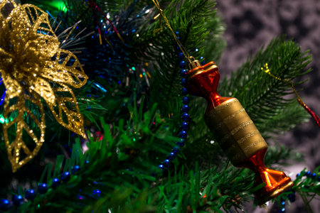 Various lanterns glow at night on the Christmas tree.の写真素材